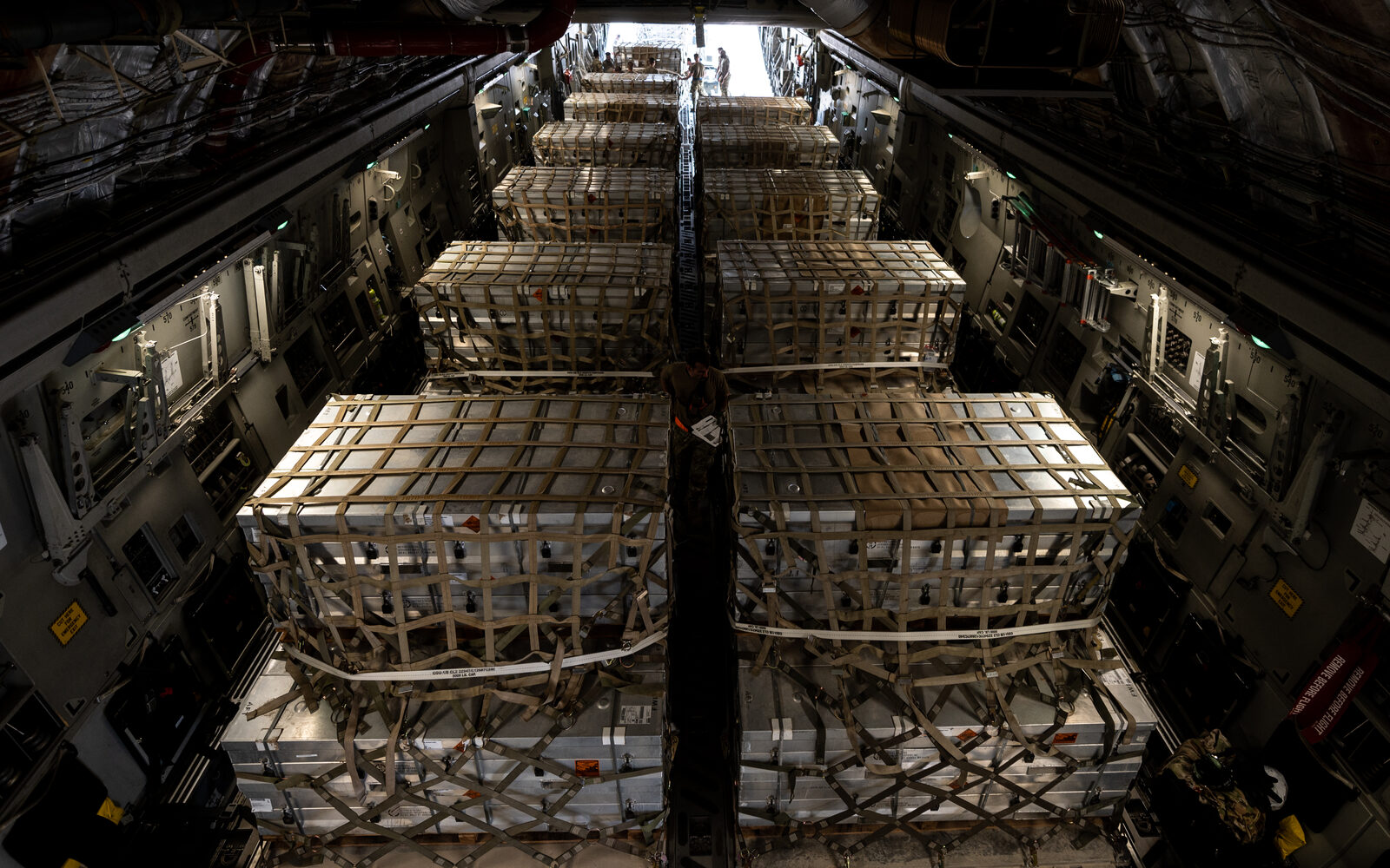Palletized cargo being loaded into a freight aircraft