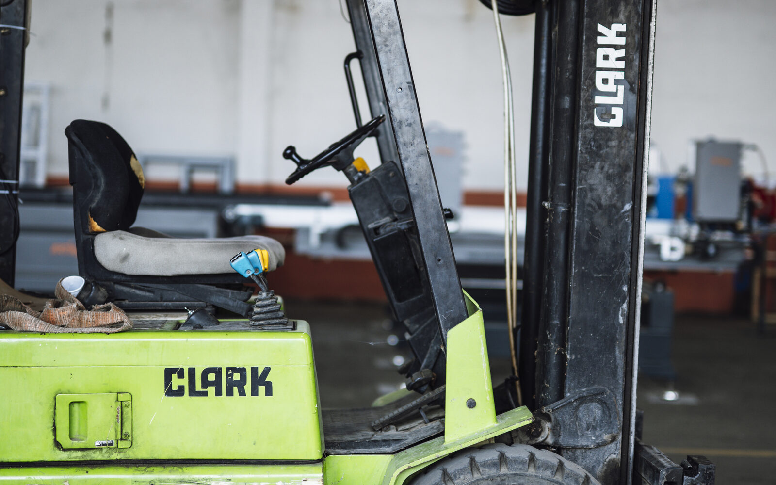 Forklift operating among stored cargo in a warehouse